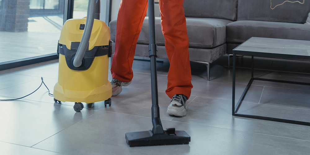Image of Employee Cleaning The Floor